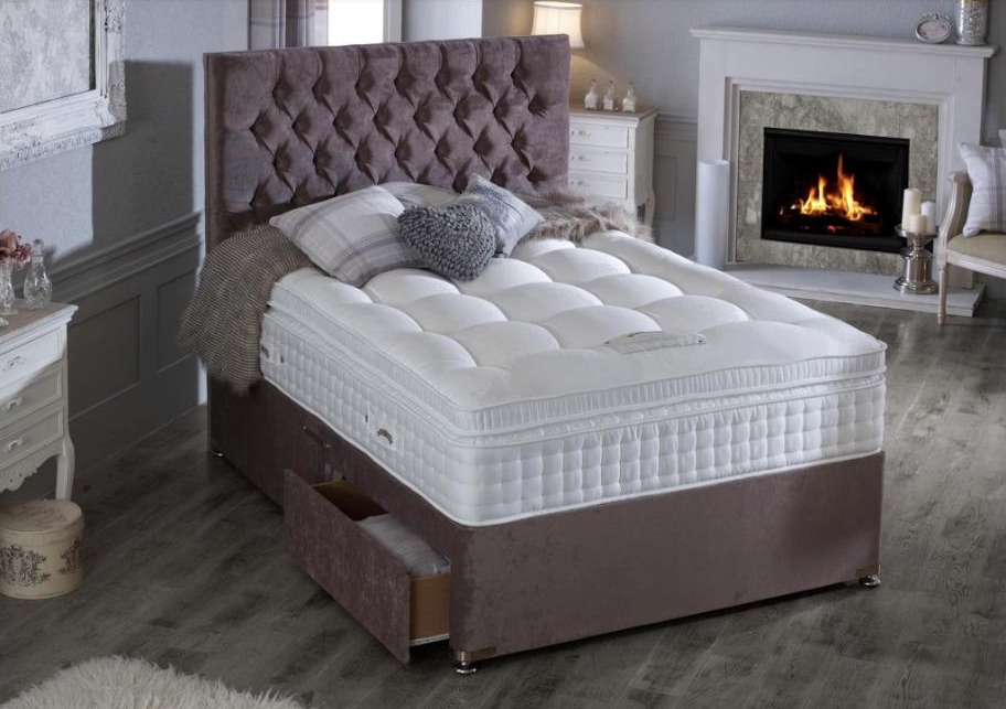 Divan bed beside a fireplace