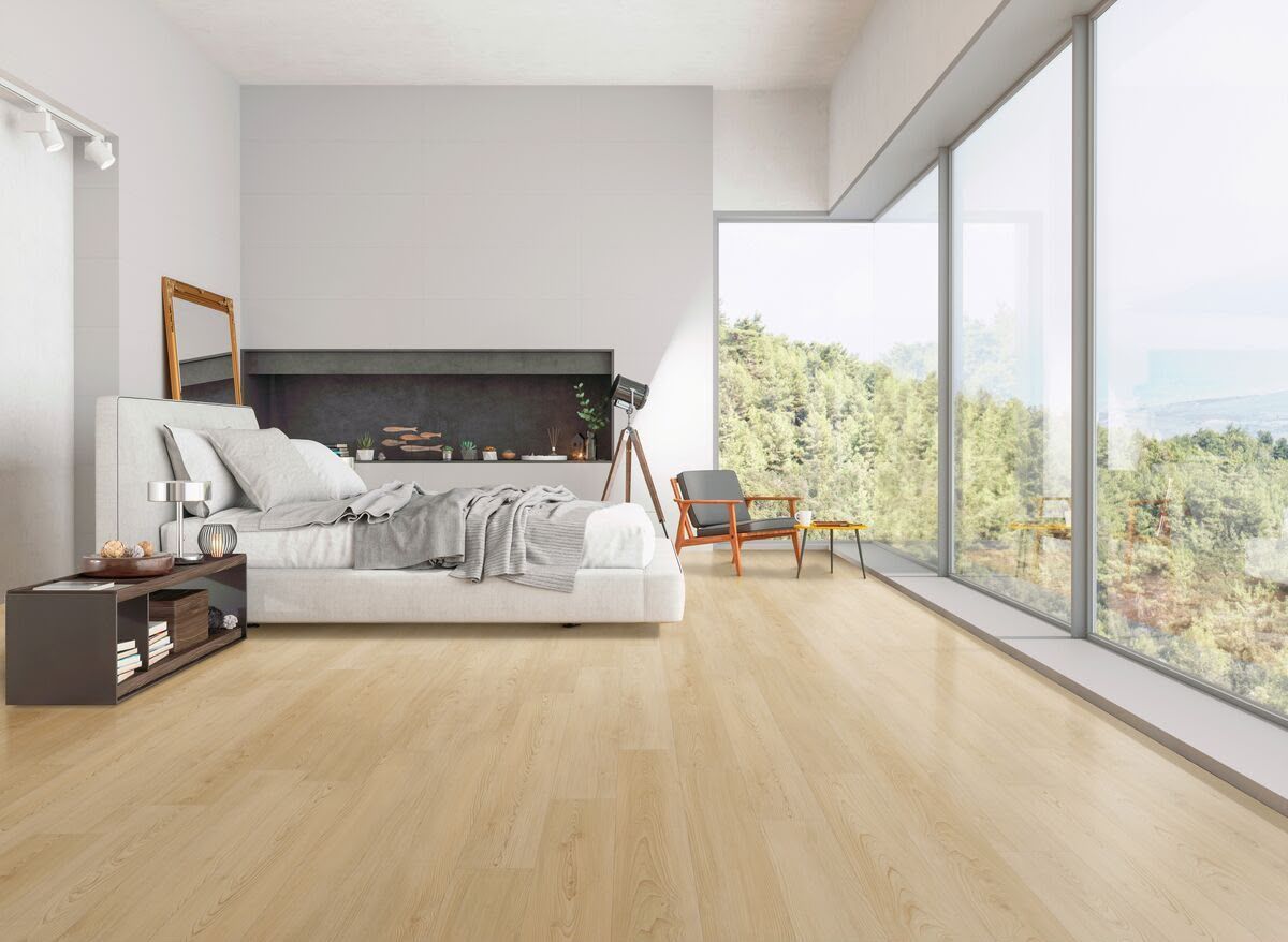 Oak plank flooring in a bright bedroom